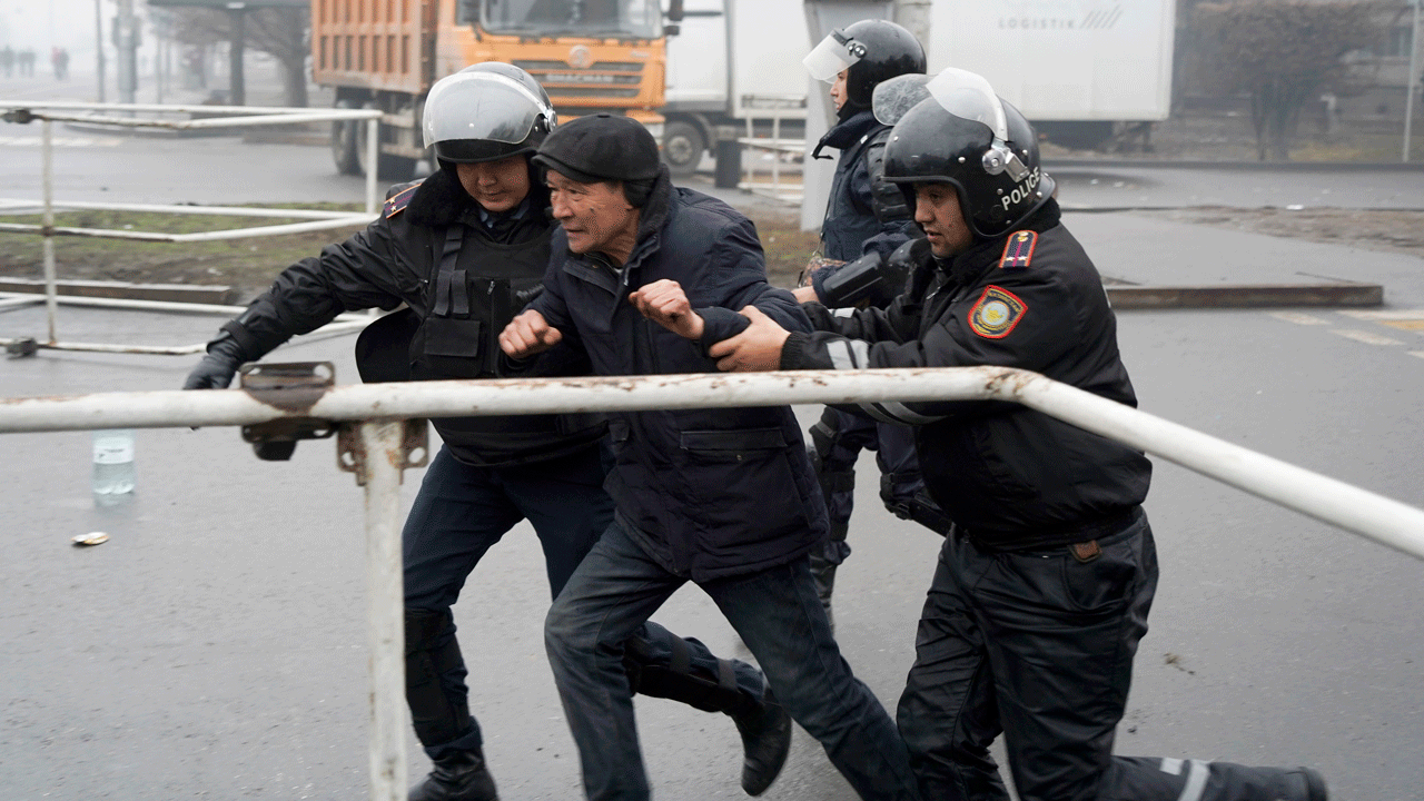 Police officers detain a demonstrator during a protest in Almaty, Kazakhstan, Wednesday, Jan. 5, 2022. Demonstrators denouncing the doubling of prices for liquefied gas clashed with police in Kazakhstan’s largest city and held protests on Tuesday in about a dozen other cities in the country.