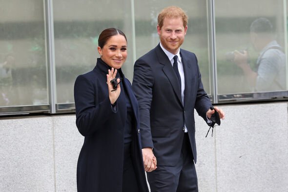 Meghan Markle and Prince Harry waving