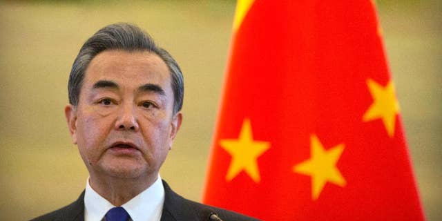 Chinese Foreign Minister Wang Yi speaks during a joint press conference with Palestinian Foreign Minister Riyad Al-Maliki at the Ministry of Foreign Affairs in Beijing, Thursday, April 13, 2017.
