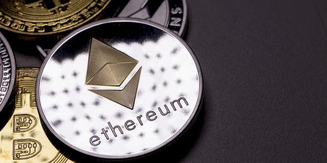 izmir, Turkey - January 12, 2018 Close up ethereum coin with other crypto coins shot in black background in studio (iStock)