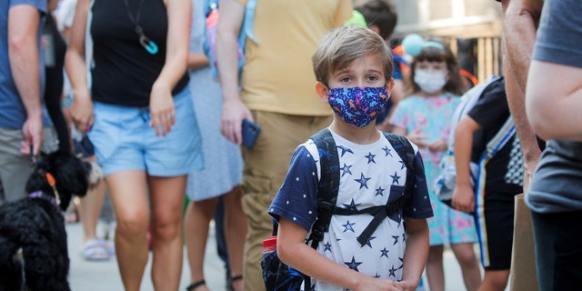 A child wears a face mask on the first day of New York City schools, amid the coronavirus (COVID-19) pandemic in Brooklyn, N.Y., back in Sept. 2021. 