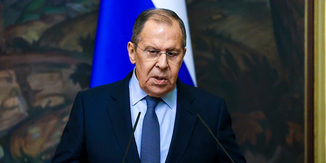 In this handout photo released by Russian Foreign Ministry Press Service, Russian Foreign Minister Sergey Lavrov gestures while speaking during a joint news conference with and German Foreign Minister Annalena Baerbock following their talks in Moscow, Russia, Tuesday, Jan. 18, 2022. 