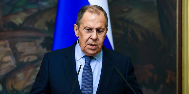 In this handout photo released by Russian Foreign Ministry Press Service, Russian Foreign Minister Sergey Lavrov gestures while speaking during a joint news conference with and German Foreign Minister Annalena Baerbock following their talks in Moscow, Russia, Tuesday, Jan. 18, 2022.