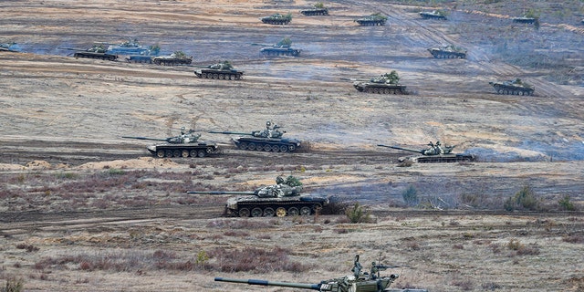 Tanks move during the Union Courage-2022 Russia-Belarus military drills at the Obuz-Lesnovsky training ground in Belarus, Saturday, Feb. 19, 2022. Russia has deployed troops to its ally Belarus for sweeping joint military drills that run through Sunday, fueling Western concerns that Moscow could use the exercise to attack Ukraine from the north.