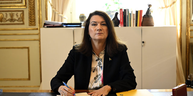 Swedish Minister of Foreign Affairs Ann Linde poses for photographers as she signs Sweden's application for NATO membership at the Ministry of Foreign Affairs, in Stockholm on Tuesday, May 17.