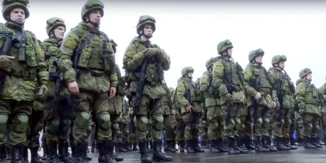 Russian recruits stand prior to their military training at the Patriot Park outside in Moscow, Russia, Saturday, Oct. 1, 2022.
