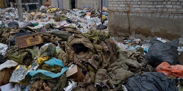 Medical waste and military clothes belonging to wounded Ukrainian soldiers outside a hospital on Dec. 26, 2022, in Bakhmut, Ukraine.