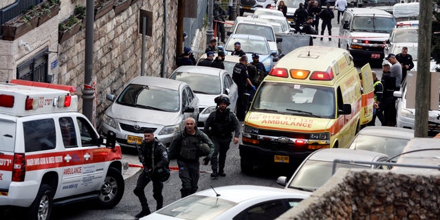 Security and rescue personnel work at a scene where a suspected incident of shooting attack took place, police spokesman said, just outside Jerusalem's Old City January 28, 2023. 