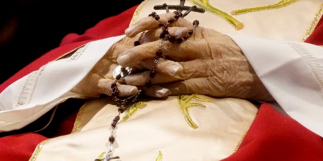 The body of late Pope Emeritus Benedict XVI is lied out in state inside St. Peter's Basilica at The Vatican, Wednesday, Jan. 4, 2023.