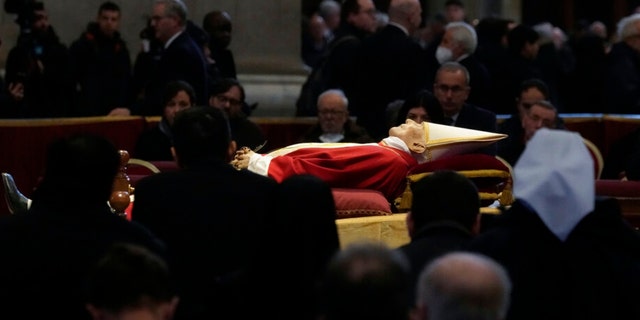 The body of late Pope Emeritus Benedict XVI is lied out in state inside St. Peter's Basilica at The Vatican, Wednesday, Jan. 4, 2023. 