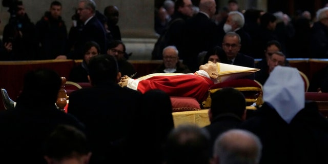 The body of late Pope Emeritus Benedict XVI is lied out in state inside St. Peter's Basilica at The Vatican, Wednesday, Jan. 4, 2023.