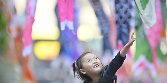 People celebrate the Children's Day, as the Golden Week, a series of four national holidays that take place within one week, comes to an end in Tokyo, Japan on May 5, 2022. 